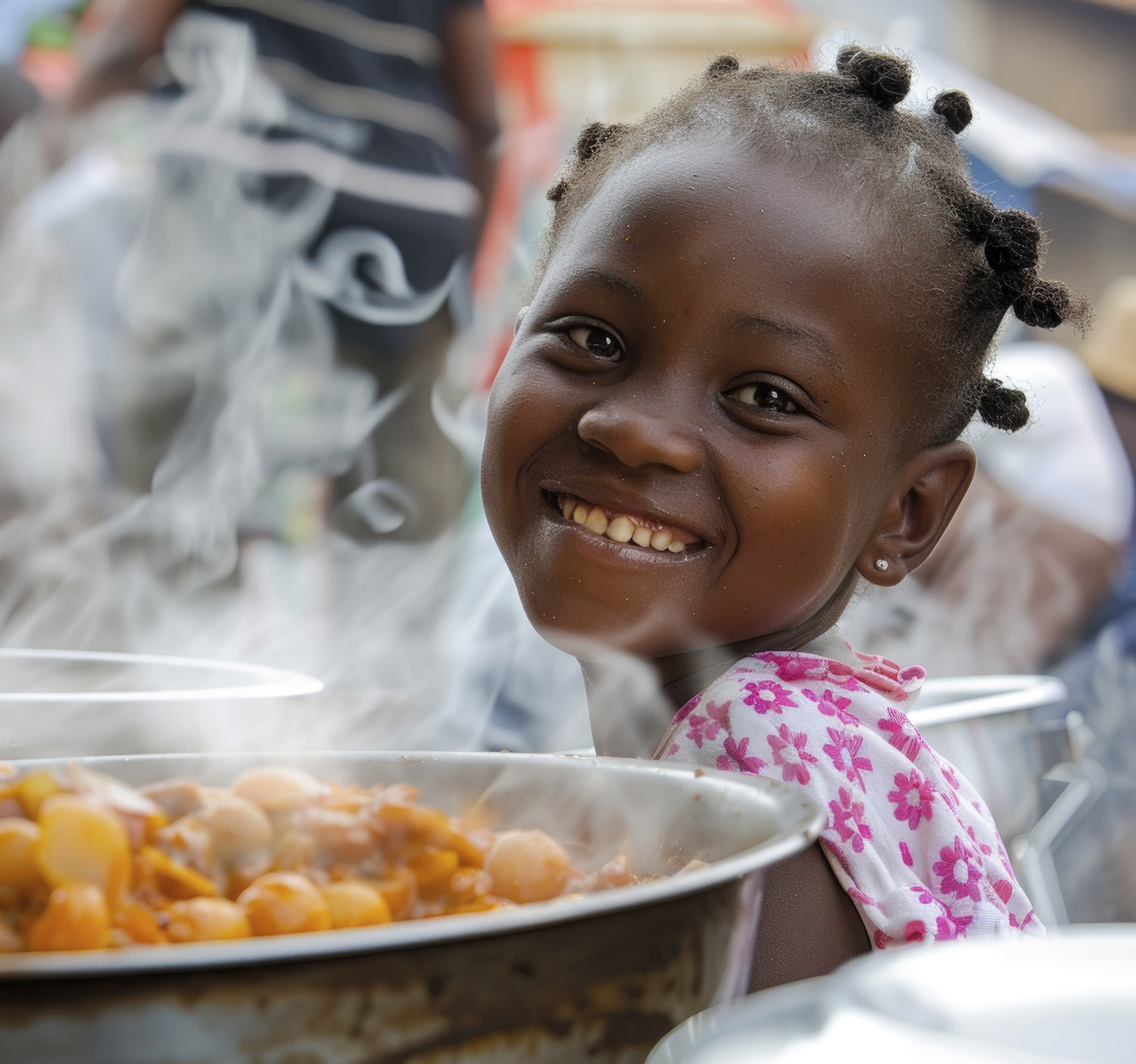 Happy child eating a nutritious meal provided by a school feeding programme